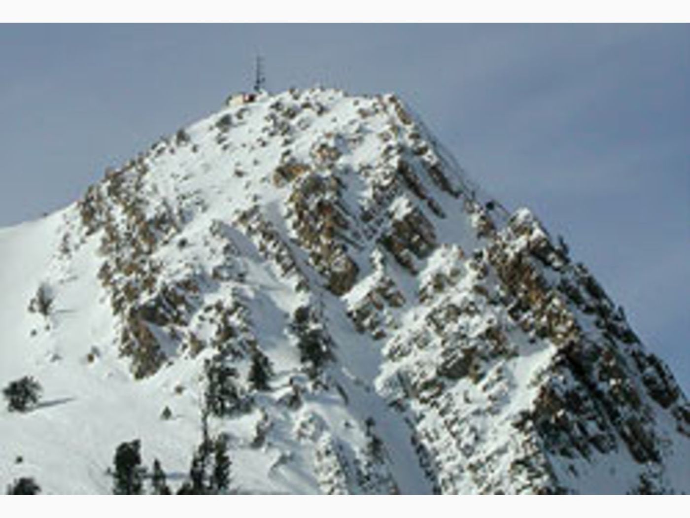 Poised on Mt. Ogden overlooking the Snow Basin venue, a Campbell Scientific weather station shares space with a communications tower. Snow Basin hosted a variety of alpine skiing events. Photography by Dan Judd.
