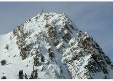Poised on Mt. Ogden overlooking the Snow Basin venue, a Campbell Scientific weather station shares space with a communications tower. Snow Basin hosted a variety of alpine skiing events. Photography by Dan Judd.